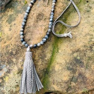 Beautiful bead and leather 30 inch necklace with textured tassel